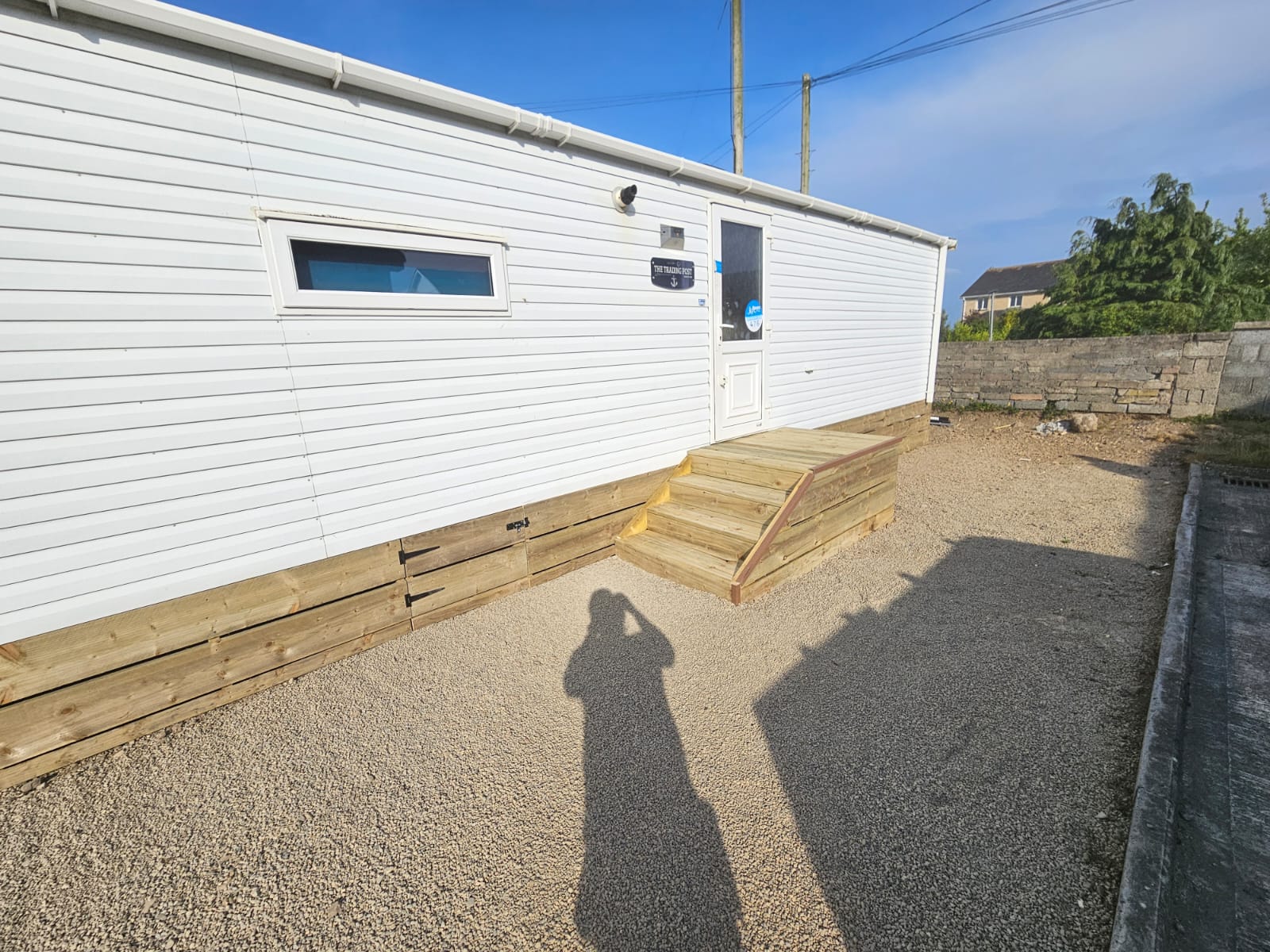 Professional mobile home site preparation complete with custom timber steps and access