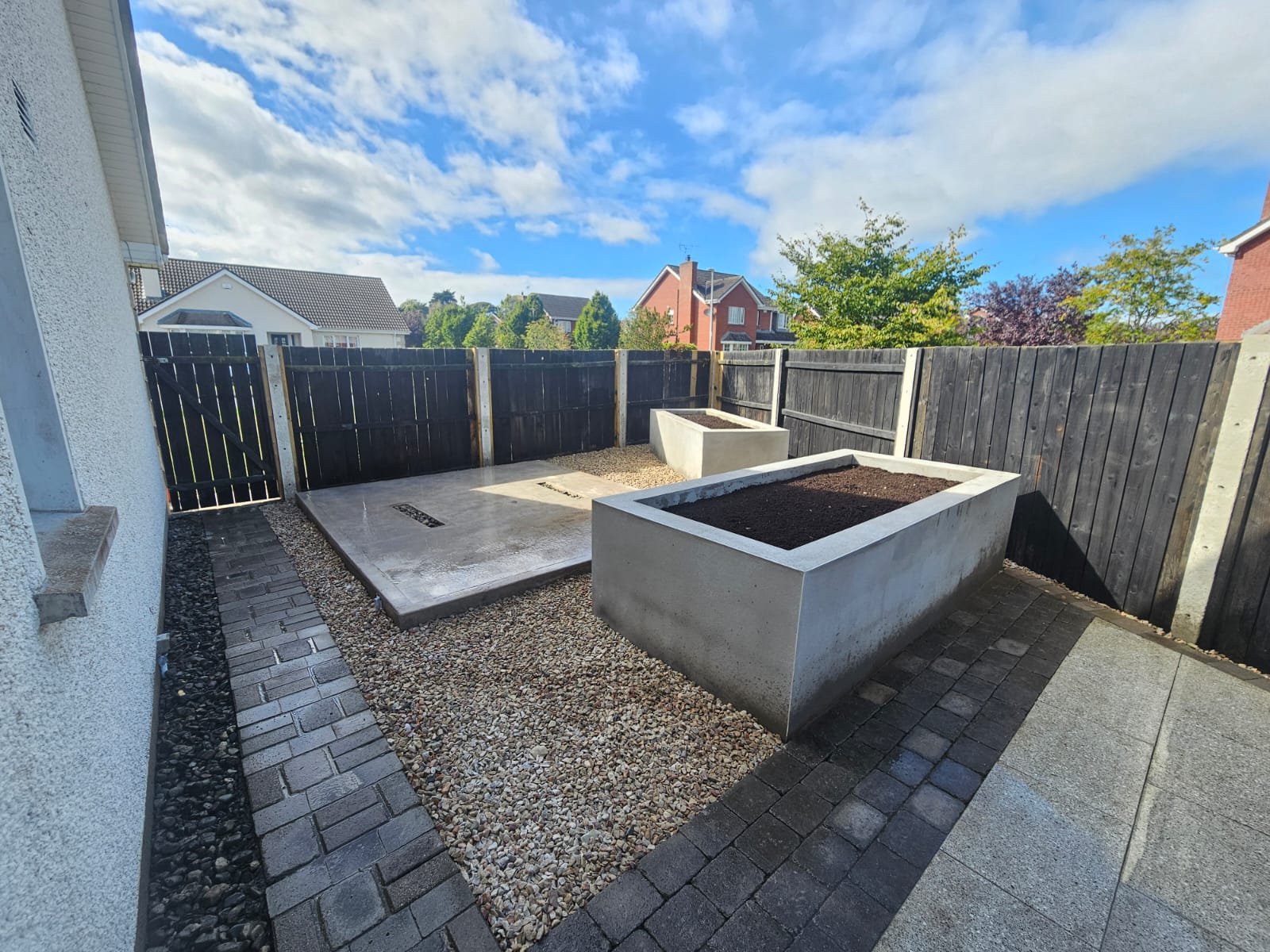 After photo showing custom concrete planters with geometric design