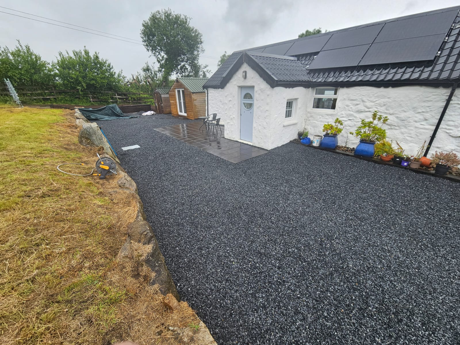 After photo showing expanded tarmac driveway with aggregate areas